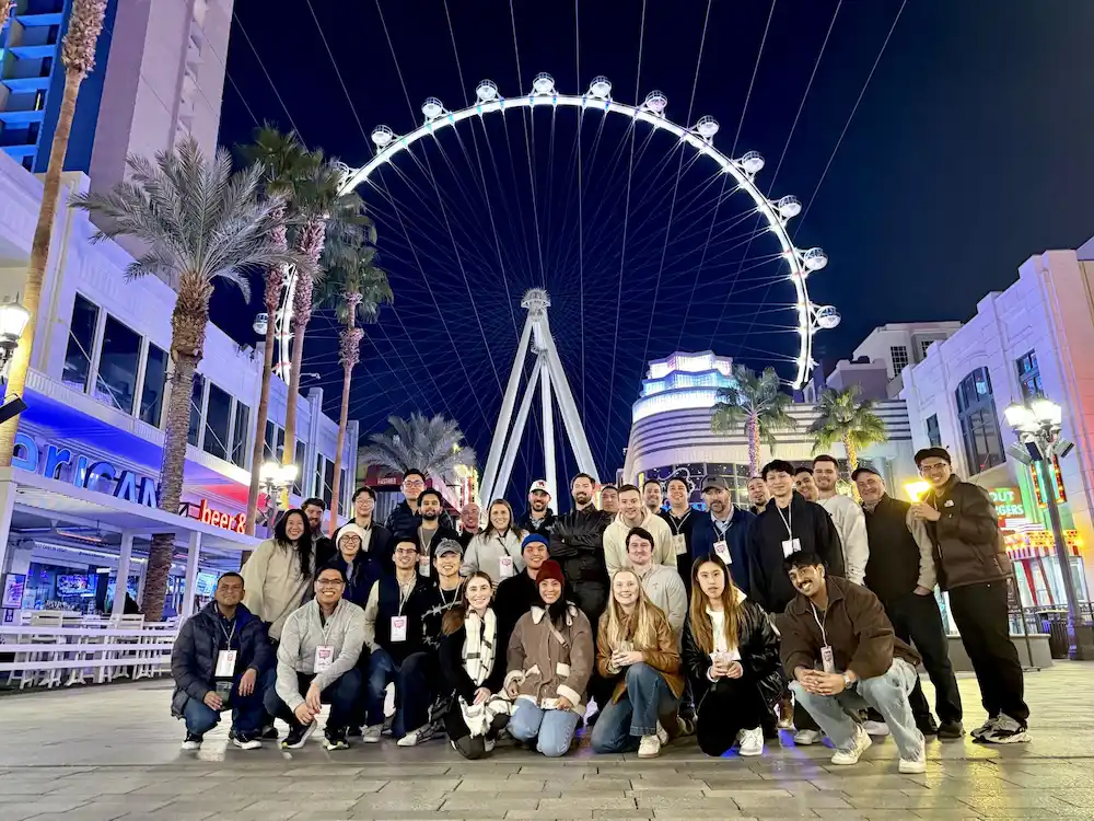 Private tour group in front of the High Roller at night